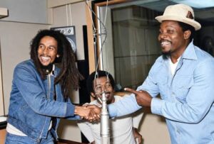 A 1979 photograph capturing a meeting between three influential Caribbean voices: Jamaican reggae legend Bob Marley, Trinidadian-born writer, storyteller and broadcaster Paul Keen Douglas, and The Mighty Sparrow (Slinger Francisco)
